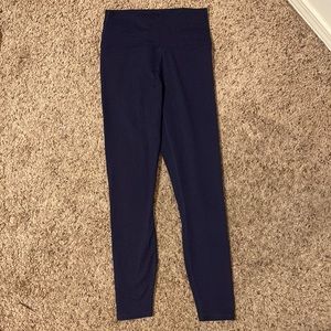 Fabletics leggings. Dark blue with purple straps. Size xs